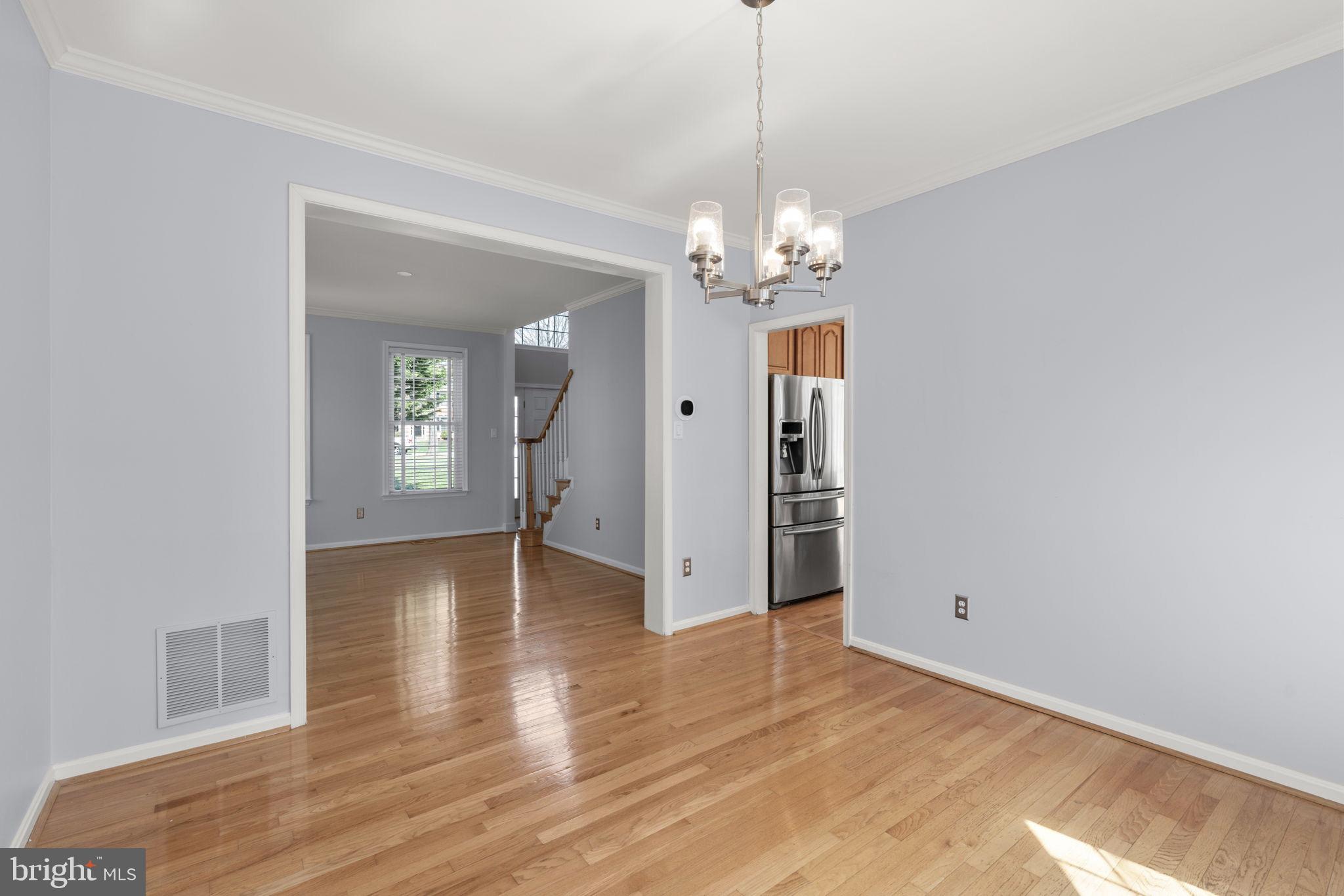 4520 Tulip Way Ellicott City, MD 21043 - Photo 15 of 63 a view of empty room with wooden floor and window
