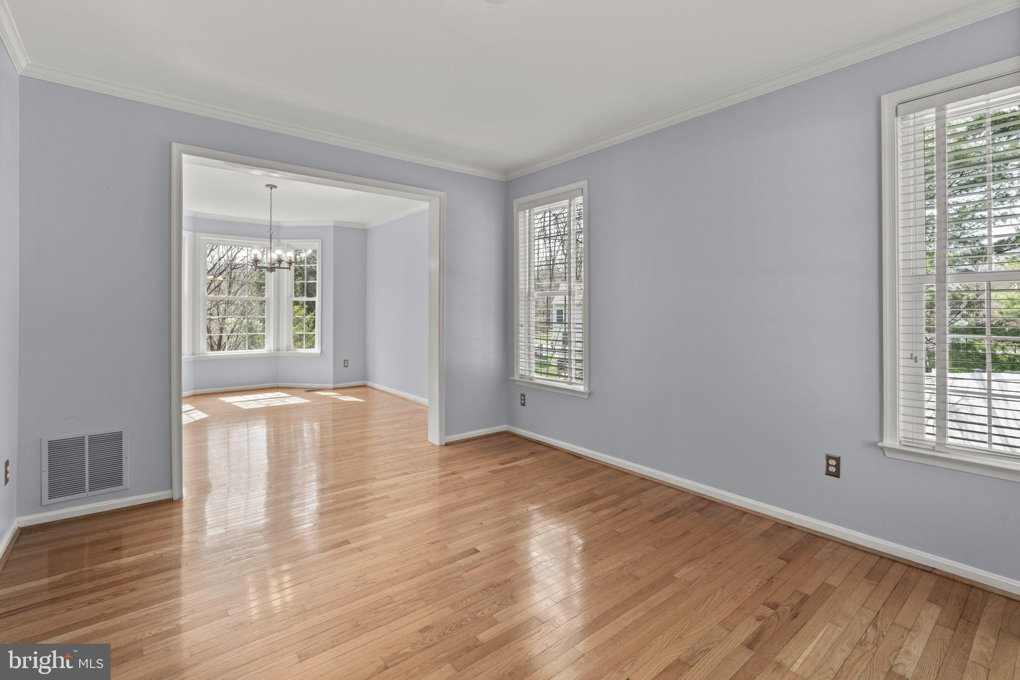 4520 Tulip Way Ellicott City, MD 21043 - Photo 16 of 63 a view of an empty room with wooden floor and a window