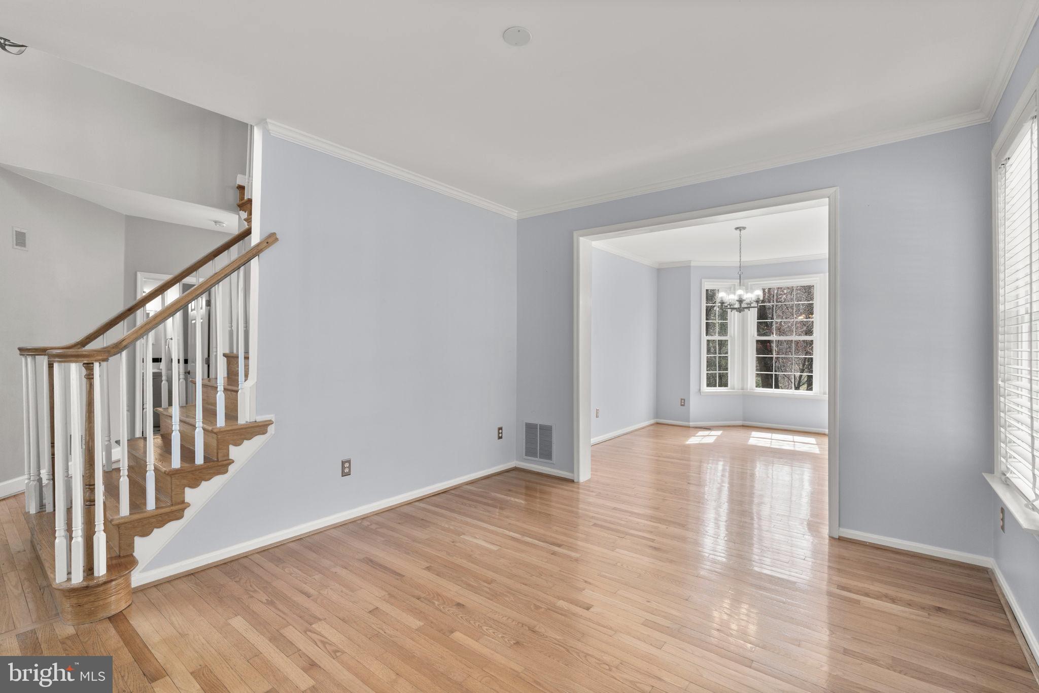 4520 Tulip Way Ellicott City, MD 21043 - Photo 17 of 63 a view of an empty room with wooden floor and a window