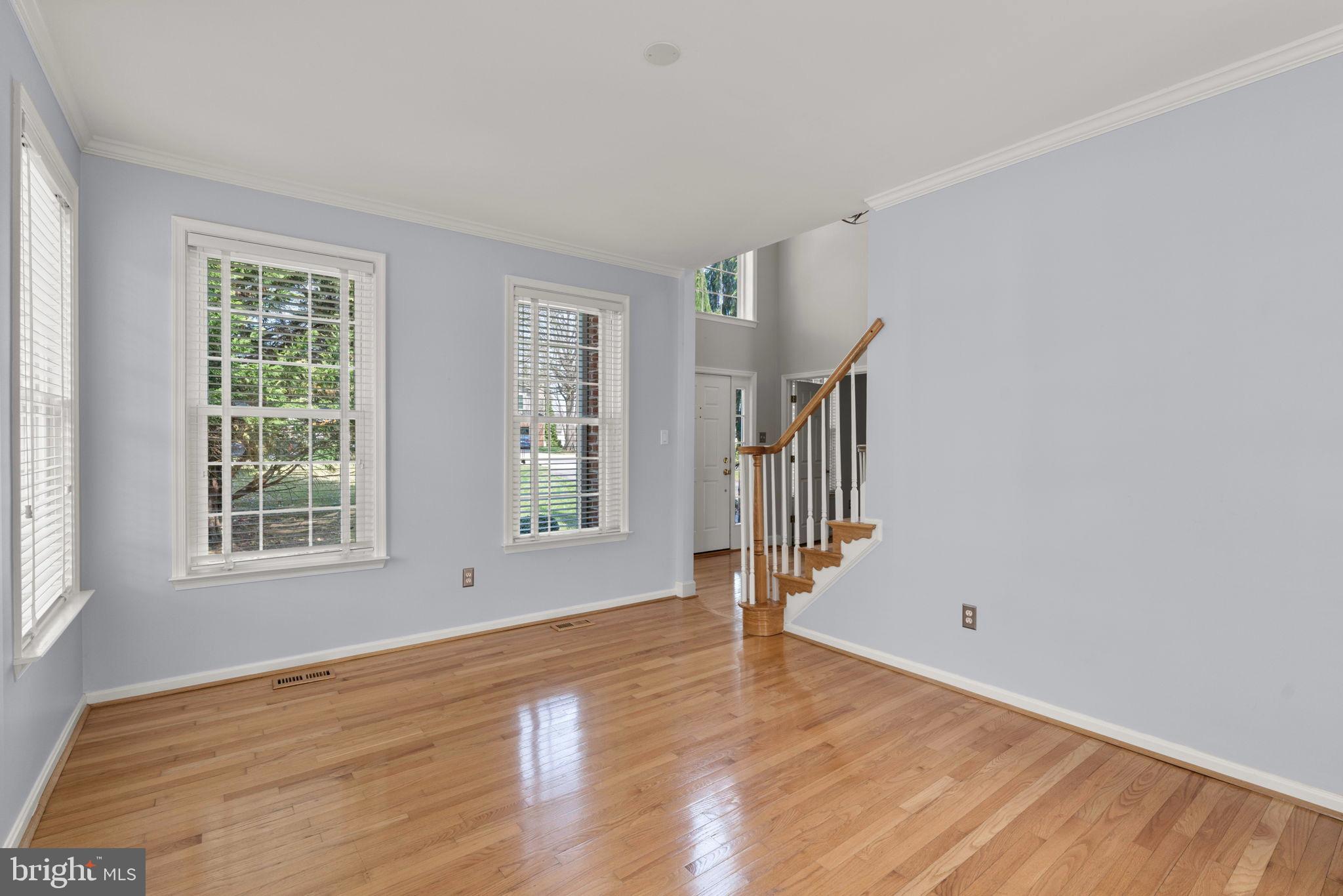 4520 Tulip Way Ellicott City, MD 21043 - Photo 18 of 63 a view of an empty room with wooden floor and a window