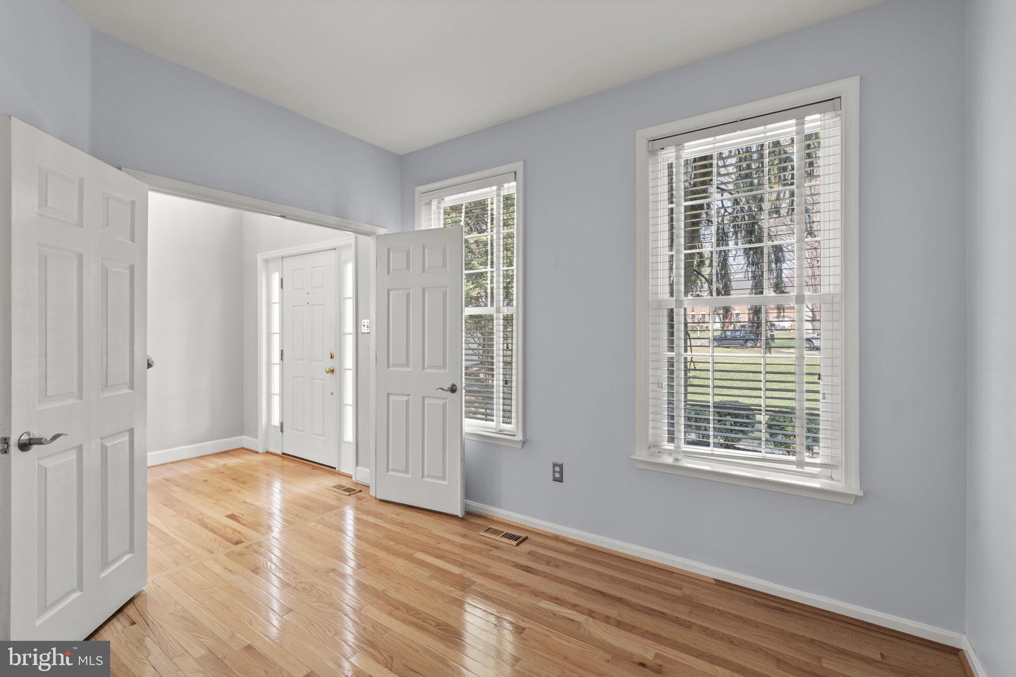 4520 Tulip Way Ellicott City, MD 21043 - Photo 19 of 63 a view of an empty room with wooden floor and a window