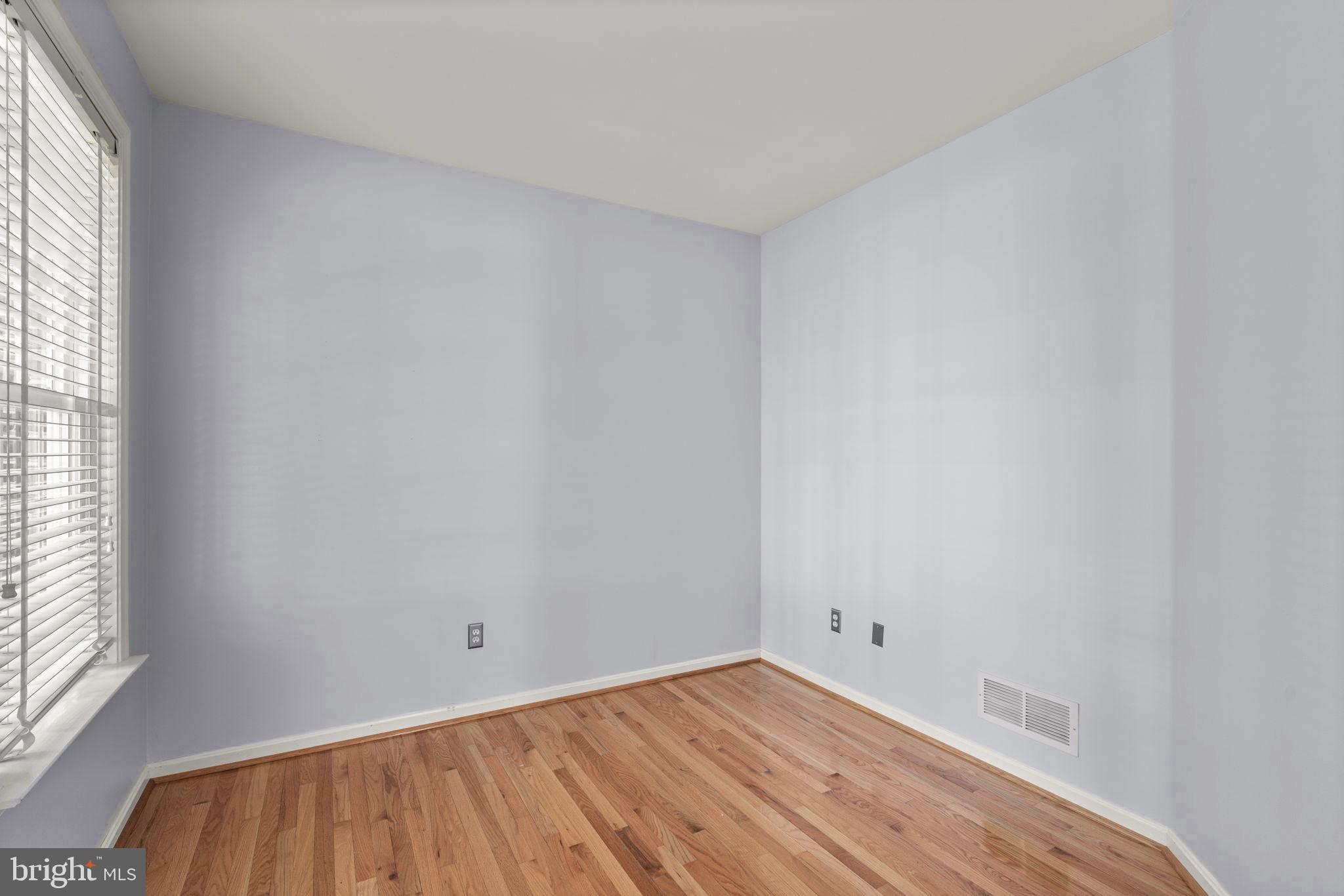 4520 Tulip Way Ellicott City, MD 21043 - Photo 21 of 63 a view of an empty room with wooden floor and a window