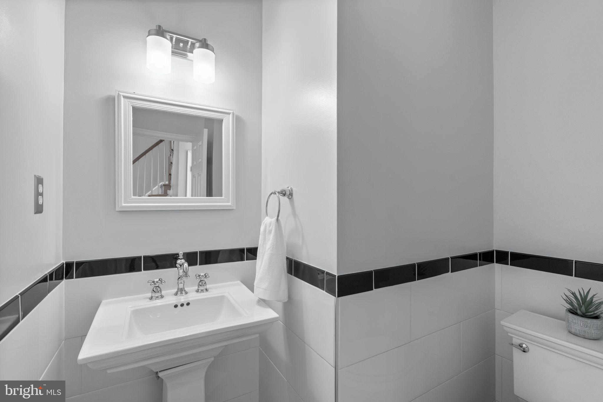 4520 Tulip Way Ellicott City, MD 21043 - Photo 22 of 63 a bathroom with a sink and a mirror