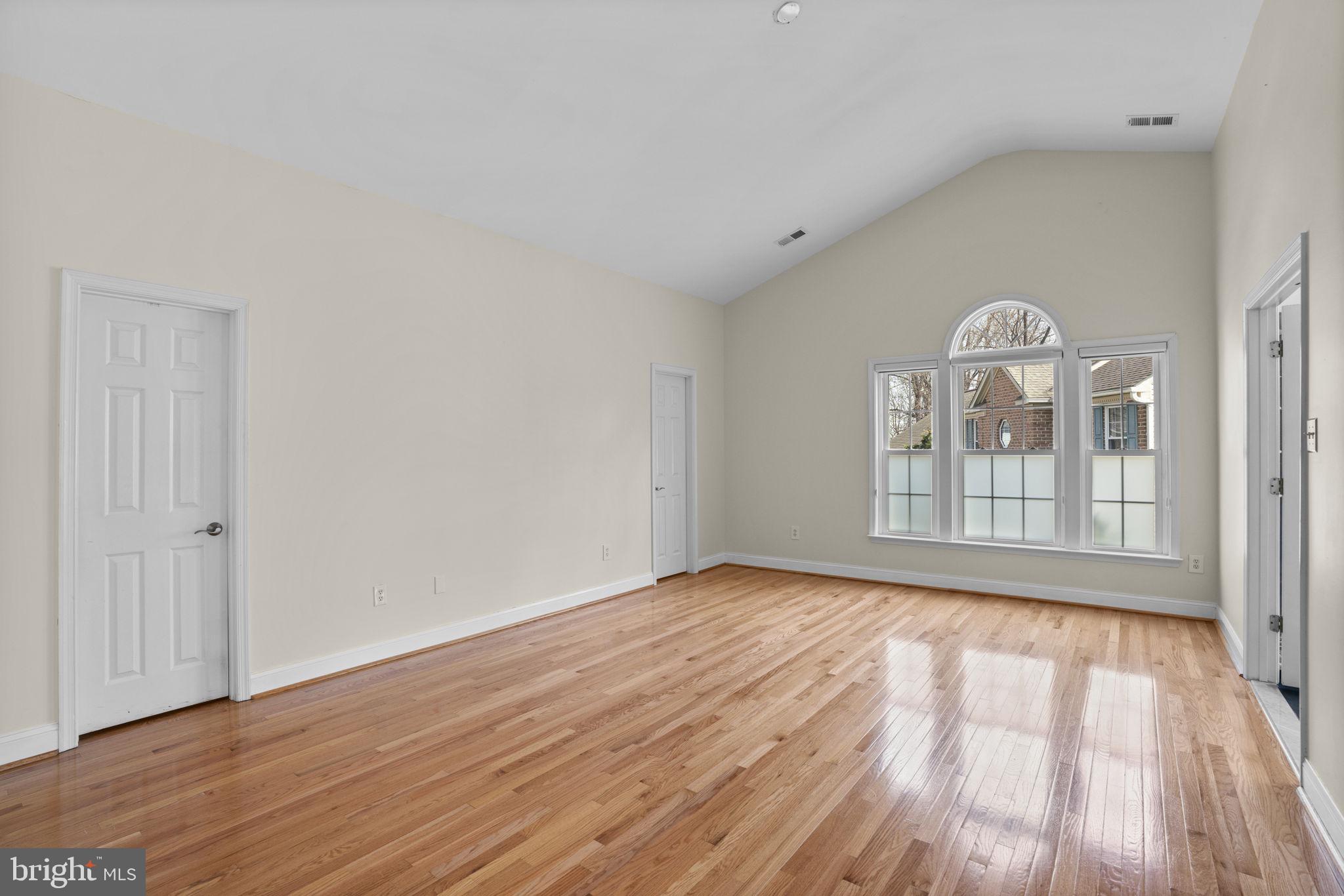 4520 Tulip Way Ellicott City, MD 21043 - Photo 25 of 63 a view of empty room with wooden floor and fan