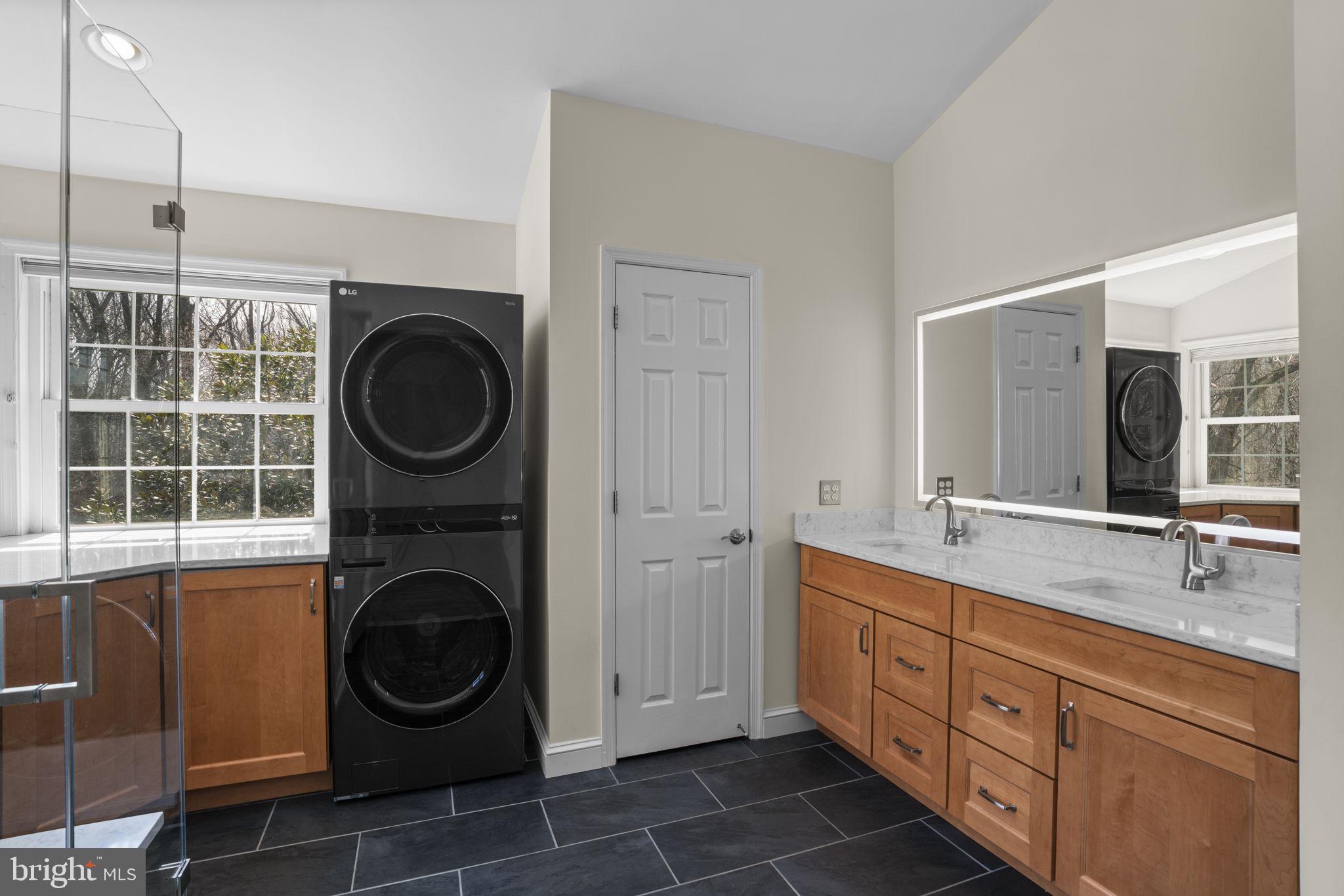 4520 Tulip Way Ellicott City, MD 21043 - Photo 28 of 63 a bathroom with a washing machine and washing machine