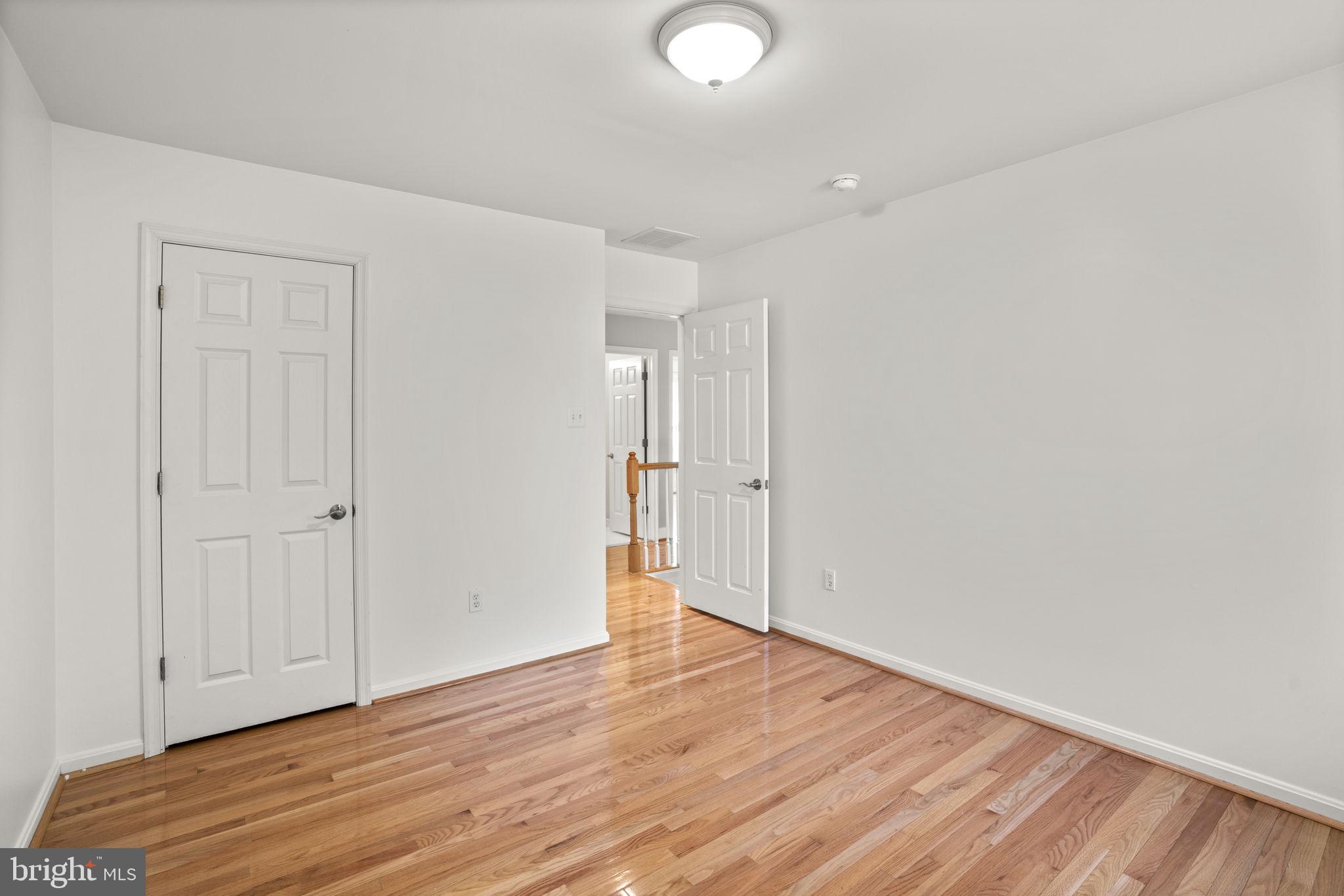 4520 Tulip Way Ellicott City, MD 21043 - Photo 37 of 63 a view of an empty room with wooden floor