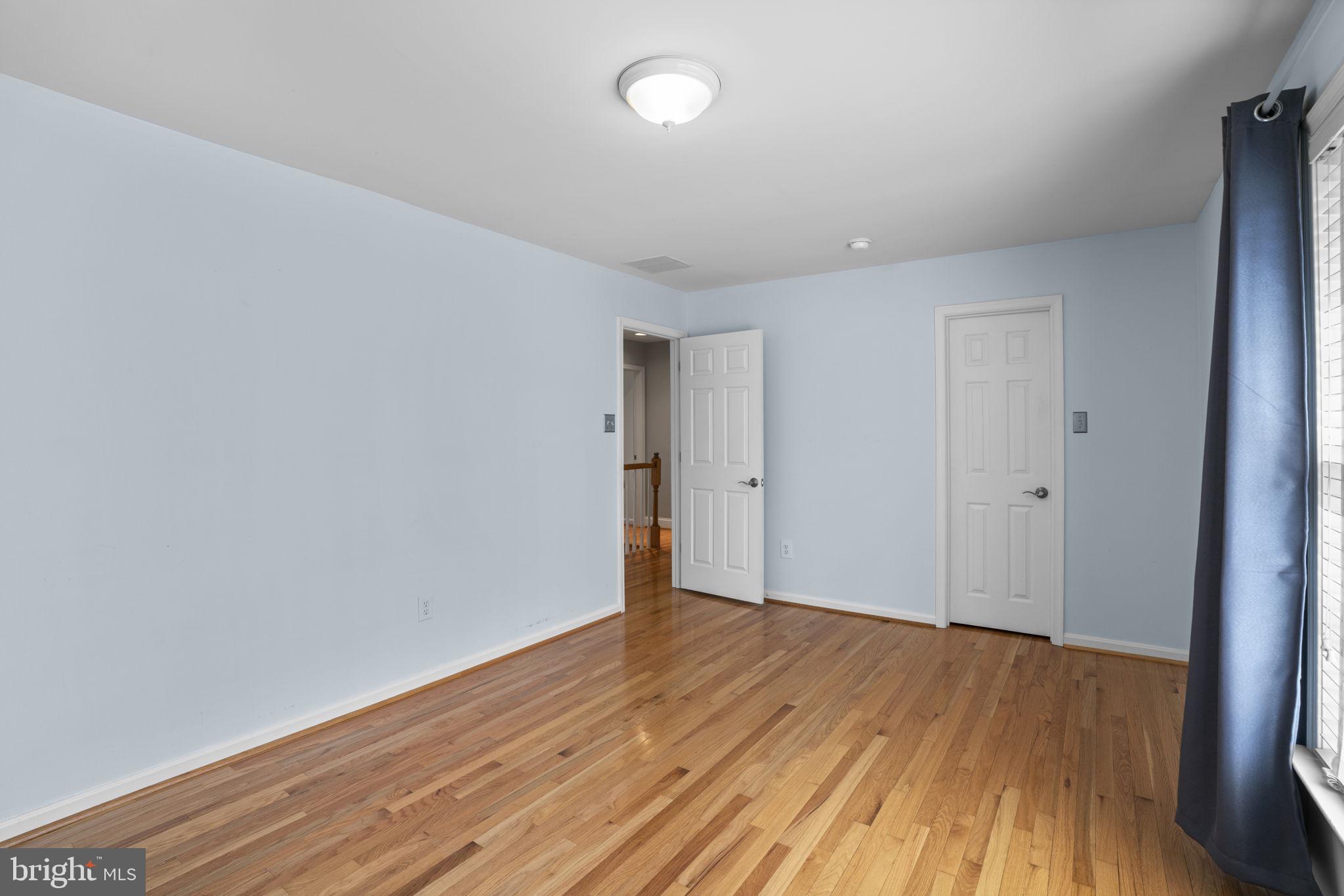 4520 Tulip Way Ellicott City, MD 21043 - Photo 40 of 63 a view of an empty room with wooden floor
