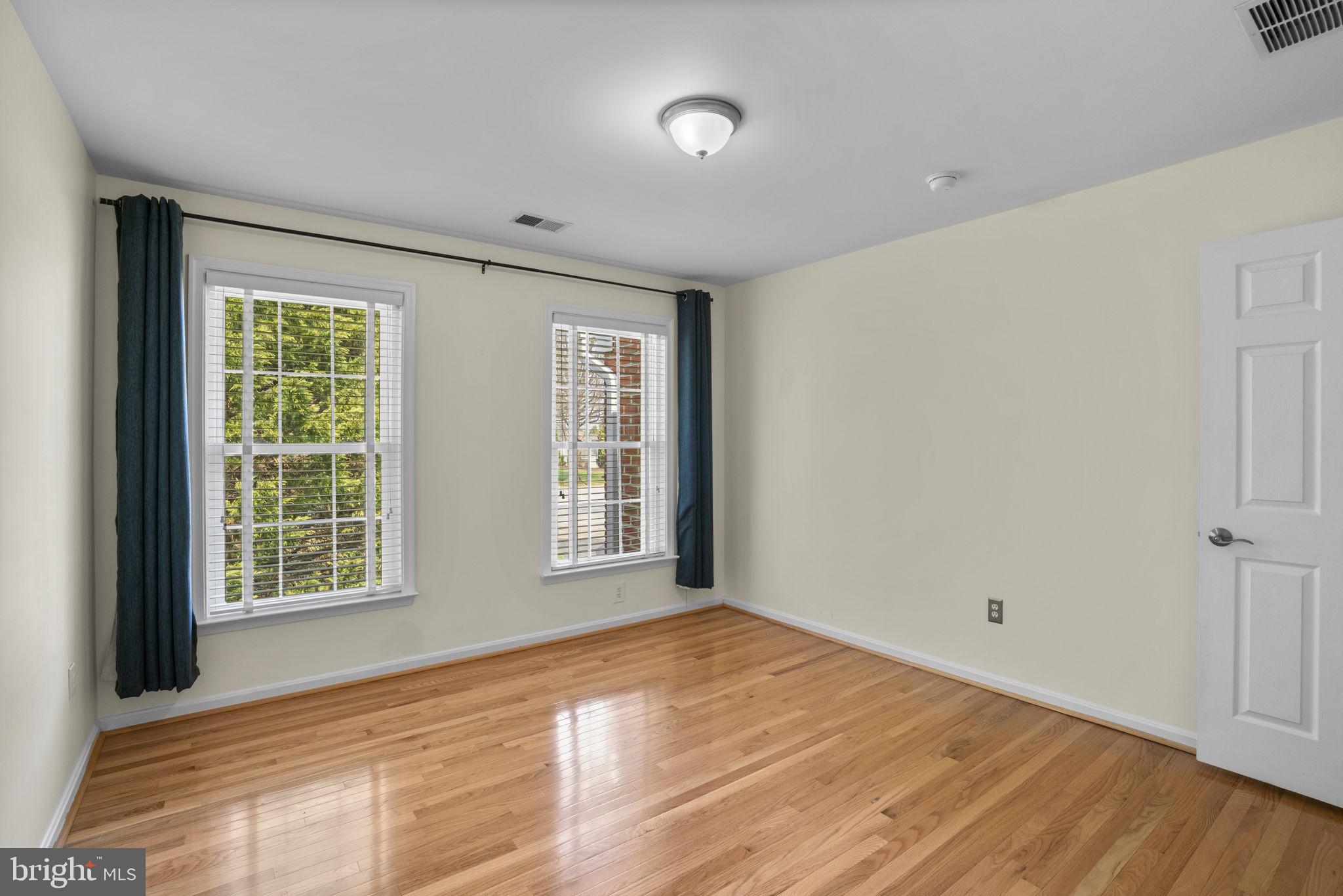4520 Tulip Way Ellicott City, MD 21043 - Photo 42 of 63 a view of an empty room with wooden floor and a window