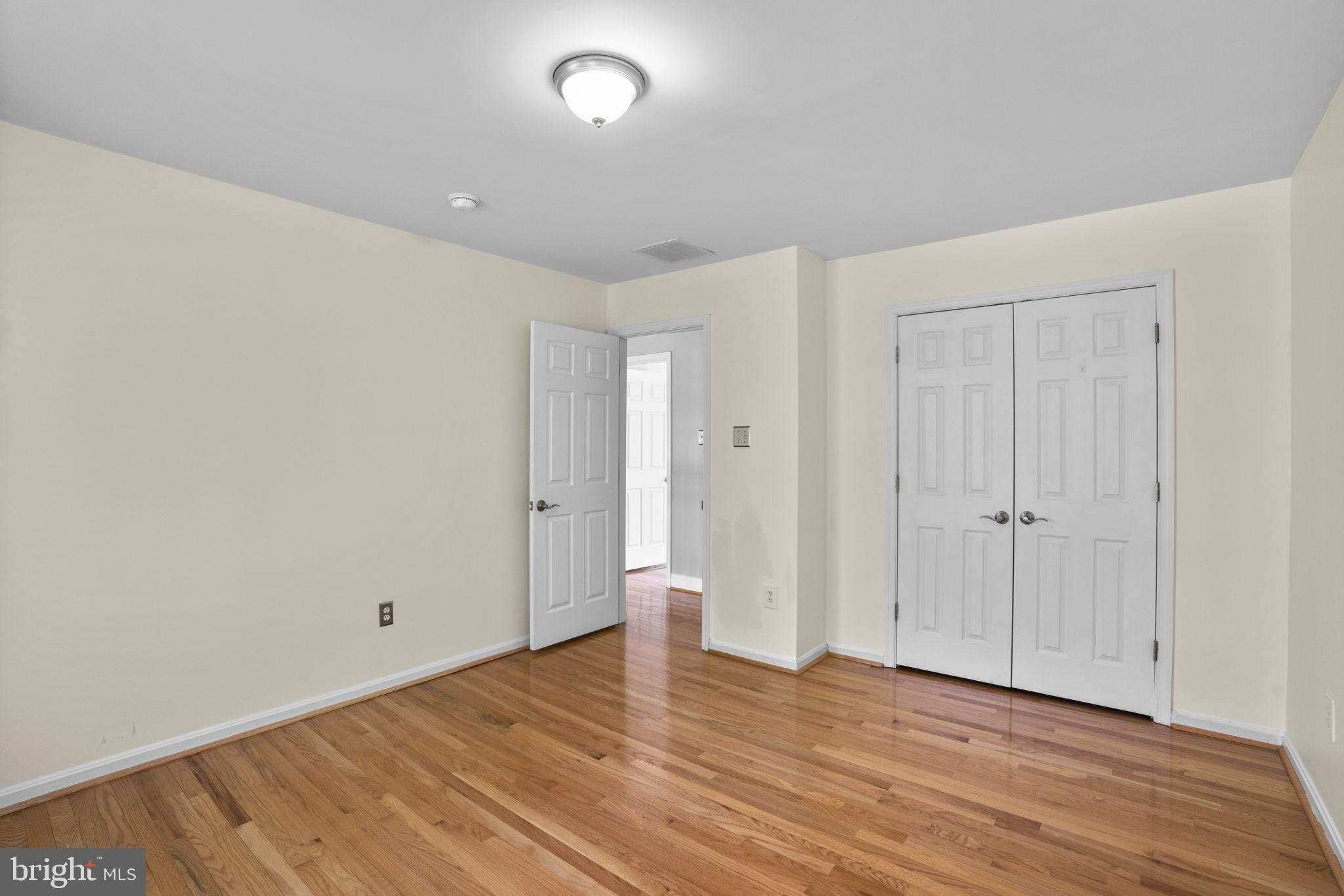 4520 Tulip Way Ellicott City, MD 21043 - Photo 43 of 63 a view of an empty room with wooden floor
