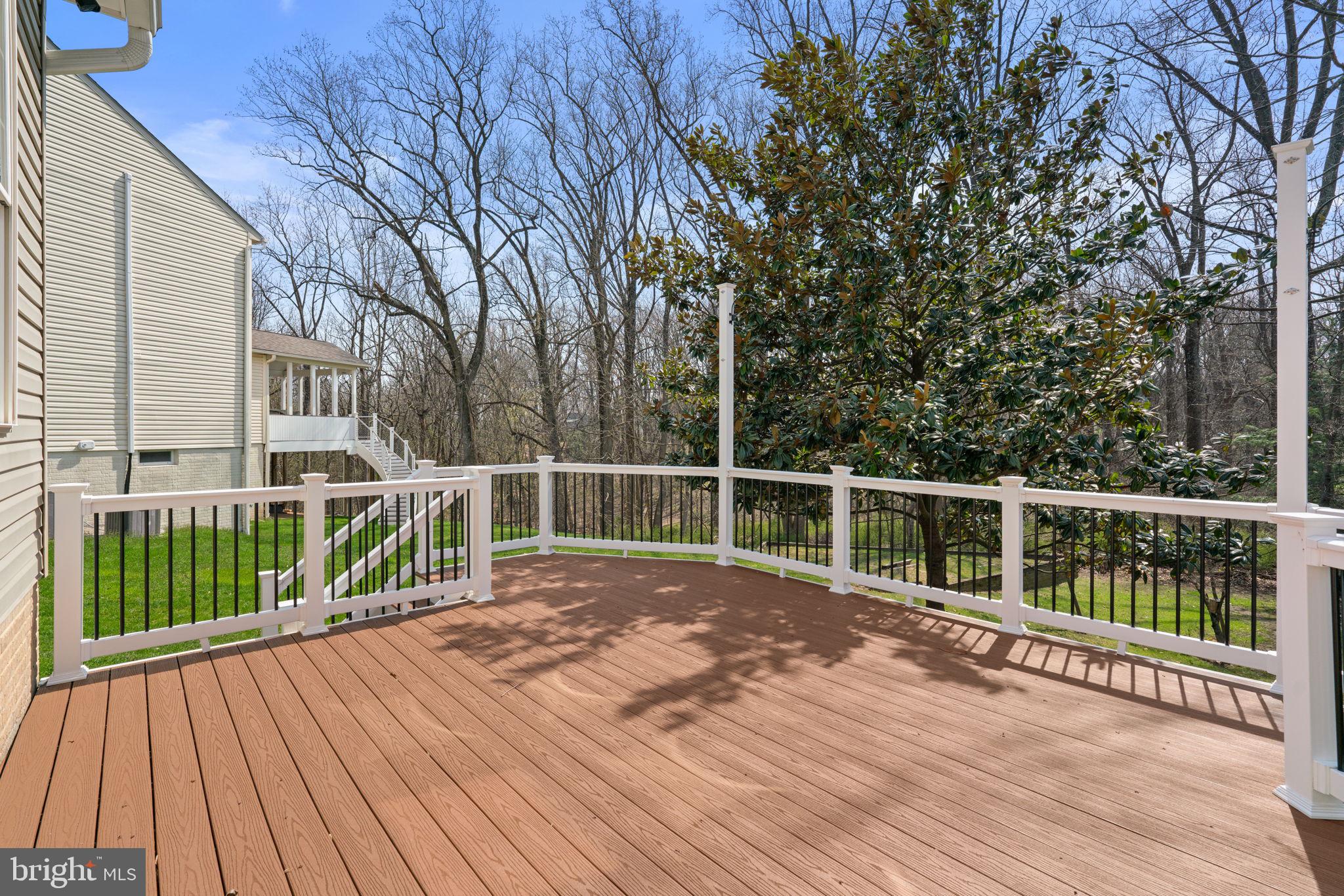 4520 Tulip Way Ellicott City, MD 21043 - Photo 47 of 63 a view of balcony with wooden floor and fence