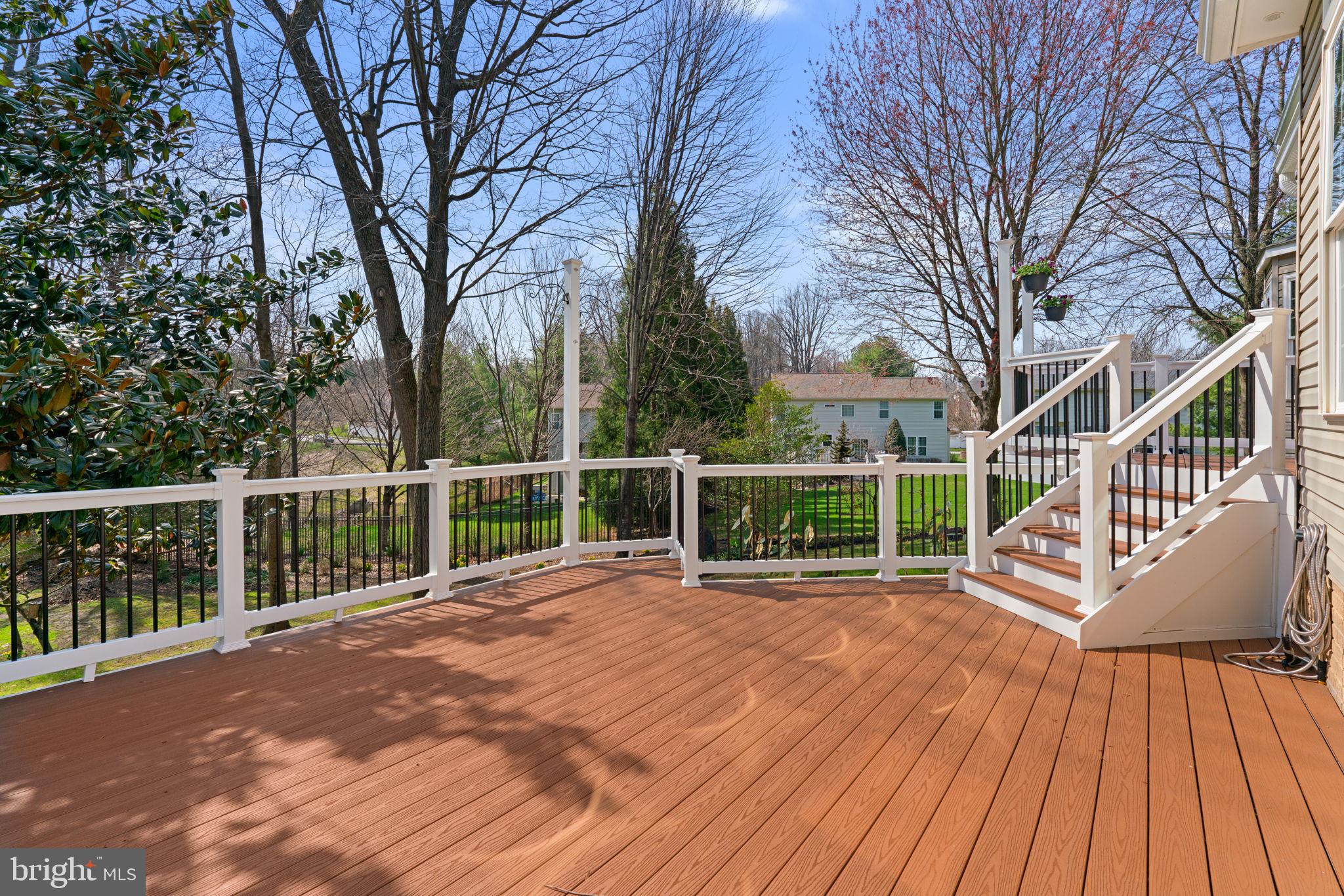 4520 Tulip Way Ellicott City, MD 21043 - Photo 48 of 63 a view of a house with a wooden deck