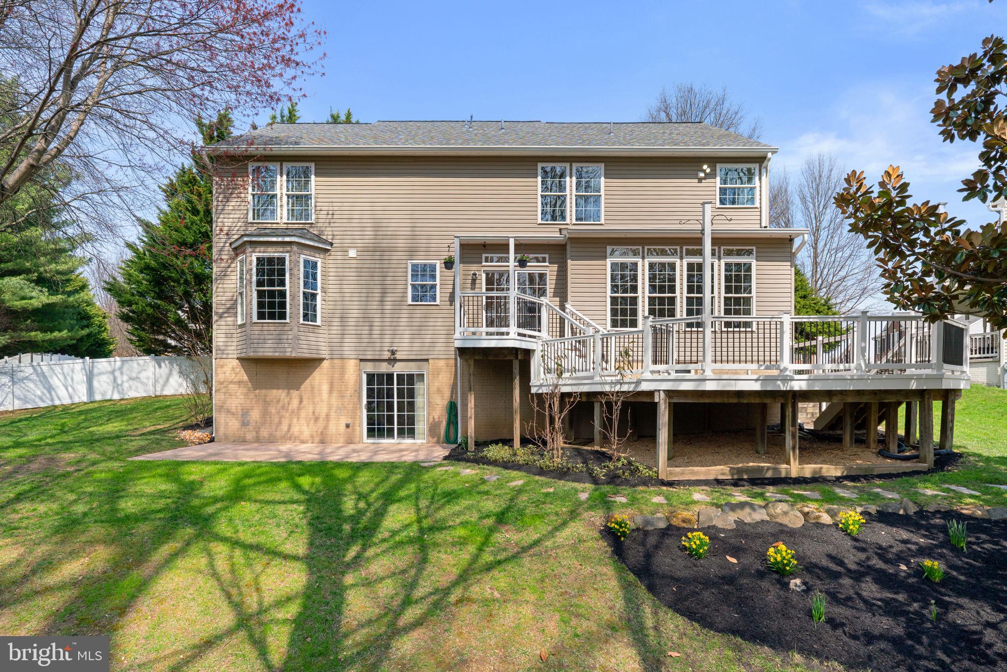 4520 Tulip Way Ellicott City, MD 21043 - Photo 56 of 63 a front view of a house with garden