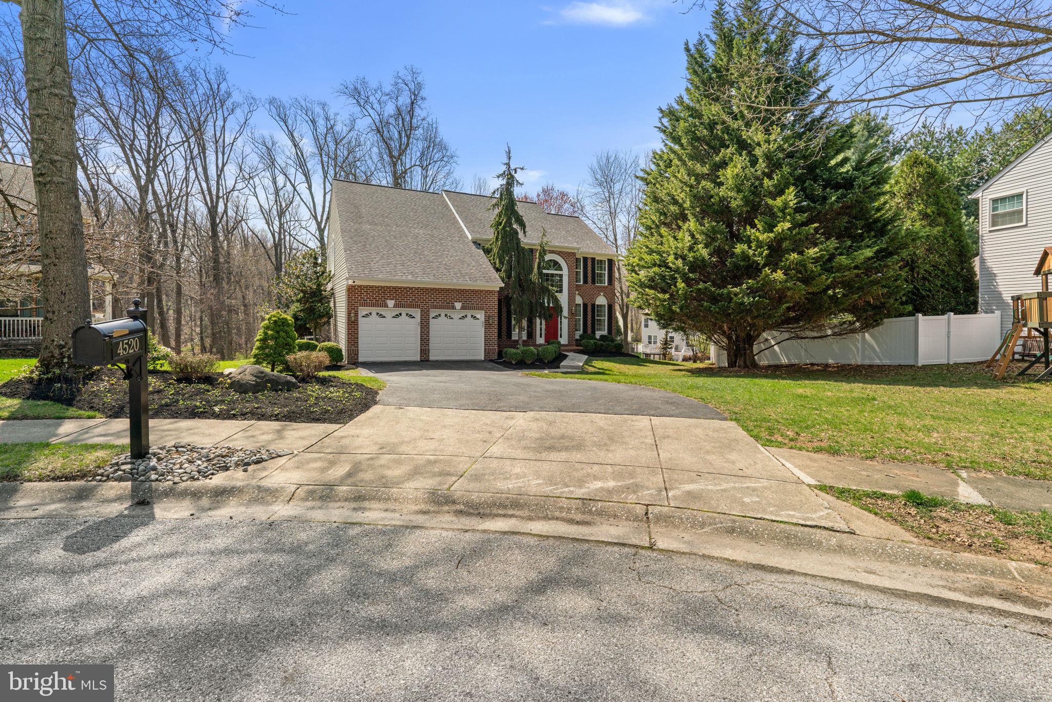 4520 Tulip Way Ellicott City, MD 21043 - Photo 59 of 63 a front view of a house with a yard
