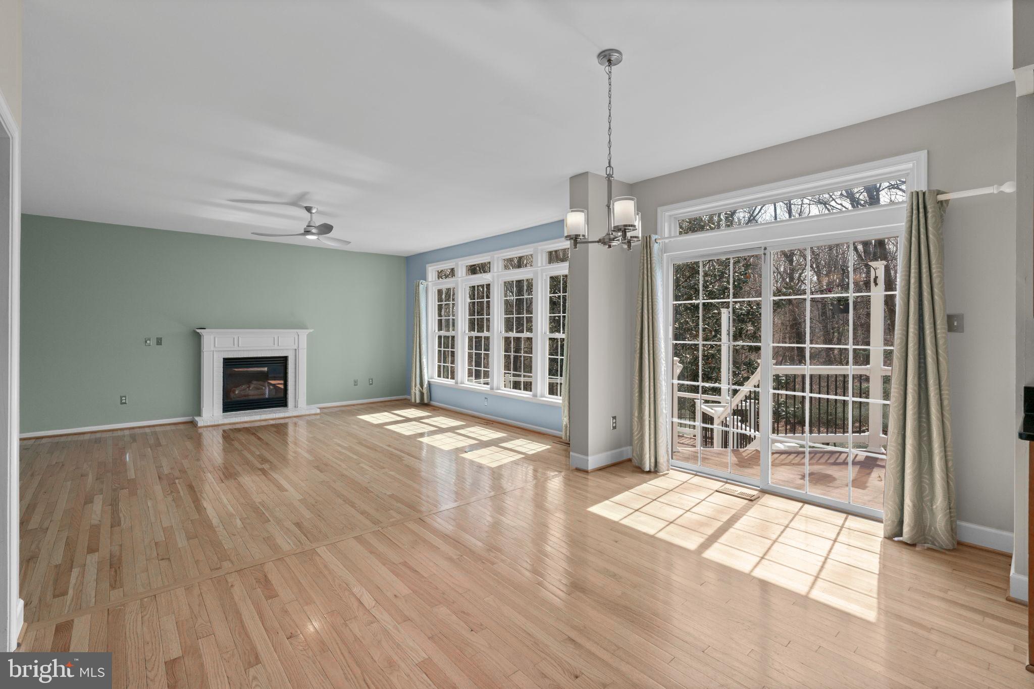 4520 Tulip Way Ellicott City, MD 21043 - Photo 8 of 63 a view of an empty room with wooden floor and a window