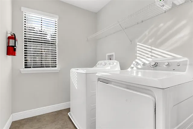 a utility room with dryer and washer