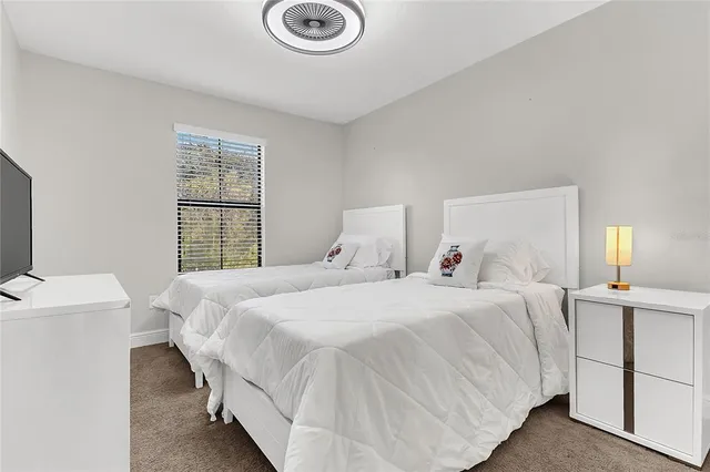 a bedroom with a bed and a table