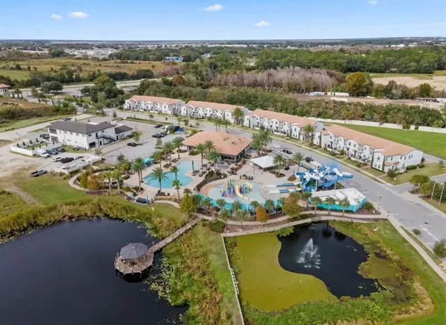 an aerial view of residential houses with outdoor space