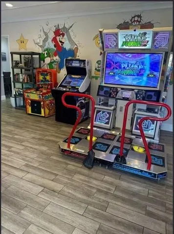 a room with gym equipment and a table
