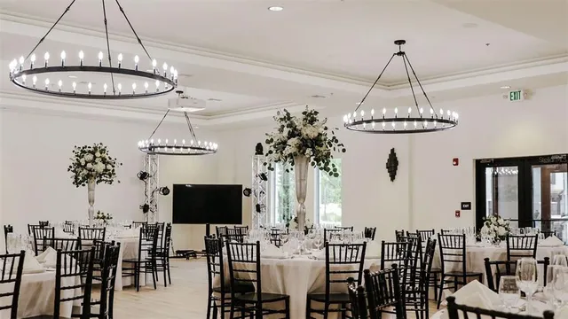 a view of a dining room with furniture wooden floor and chandelier