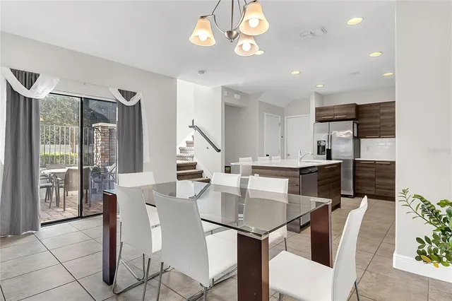 a view of kitchen with cabinets and window