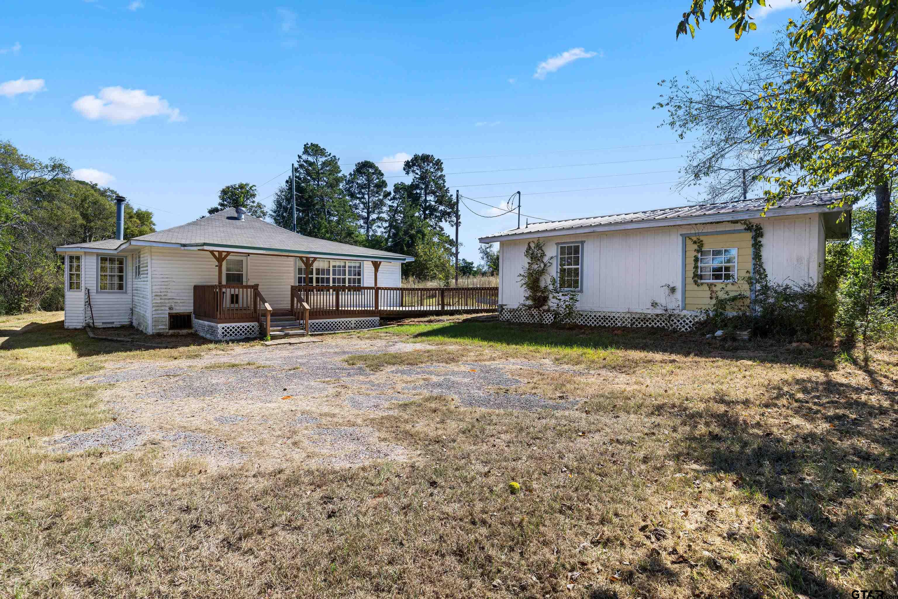 1159 County Road Mount Enterprise, TX 75681 - Photo 23 of 27 a house view with a garden space
