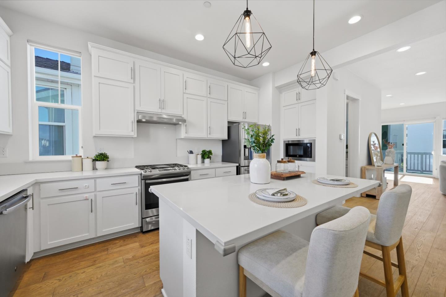 37471 Bay Crest Road Newark, CA 94560 - Photo 11 of 71 a kitchen with stainless steel appliances granite countertop a sink a stove a dining table and chairs
