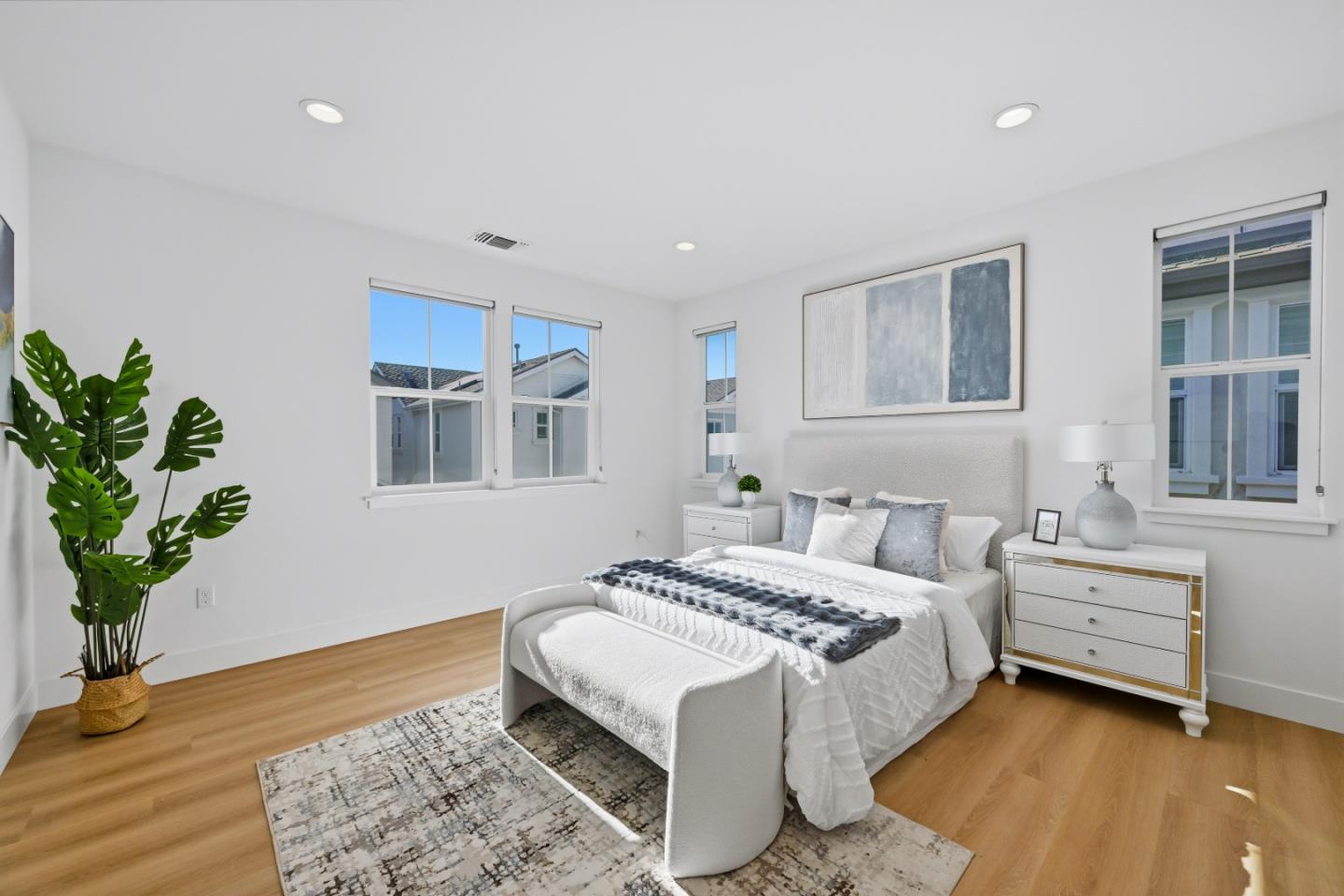 37471 Bay Crest Road Newark, CA 94560 - Photo 18 of 71 a spacious bedroom with a bed and a potted plant
