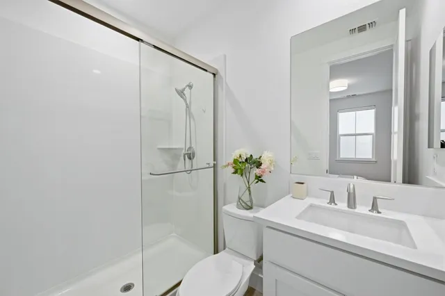 a view of a chairs and table in the balcony