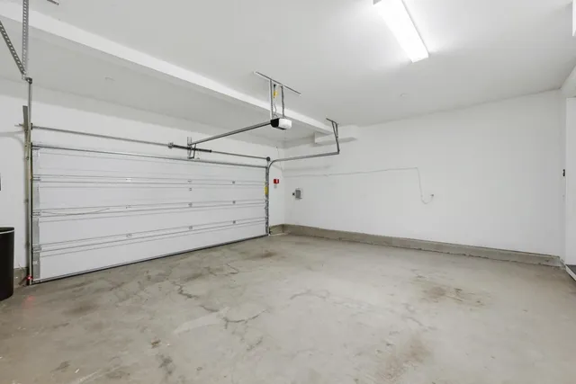 a patio with glass table and chairs