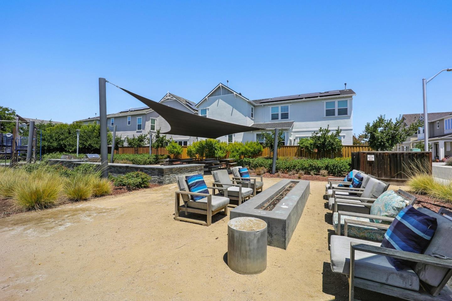 37471 Bay Crest Road Newark, CA 94560 - Photo 60 of 71 a view of a patio with chairs and a table with swimming pool