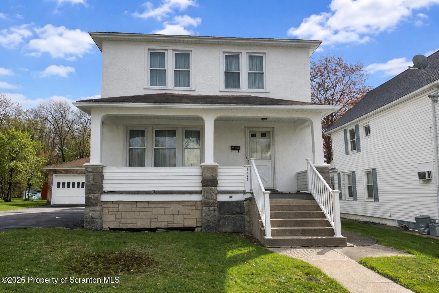 2120 Myrtle Street Scranton, PA 18510 - Photo 1 of 42 a view of a house with backyard and a tree