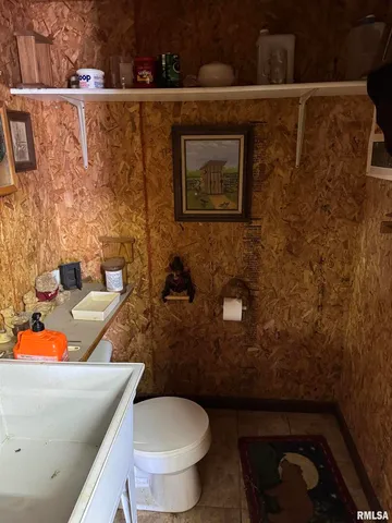 a bathroom with a toilet and a sink