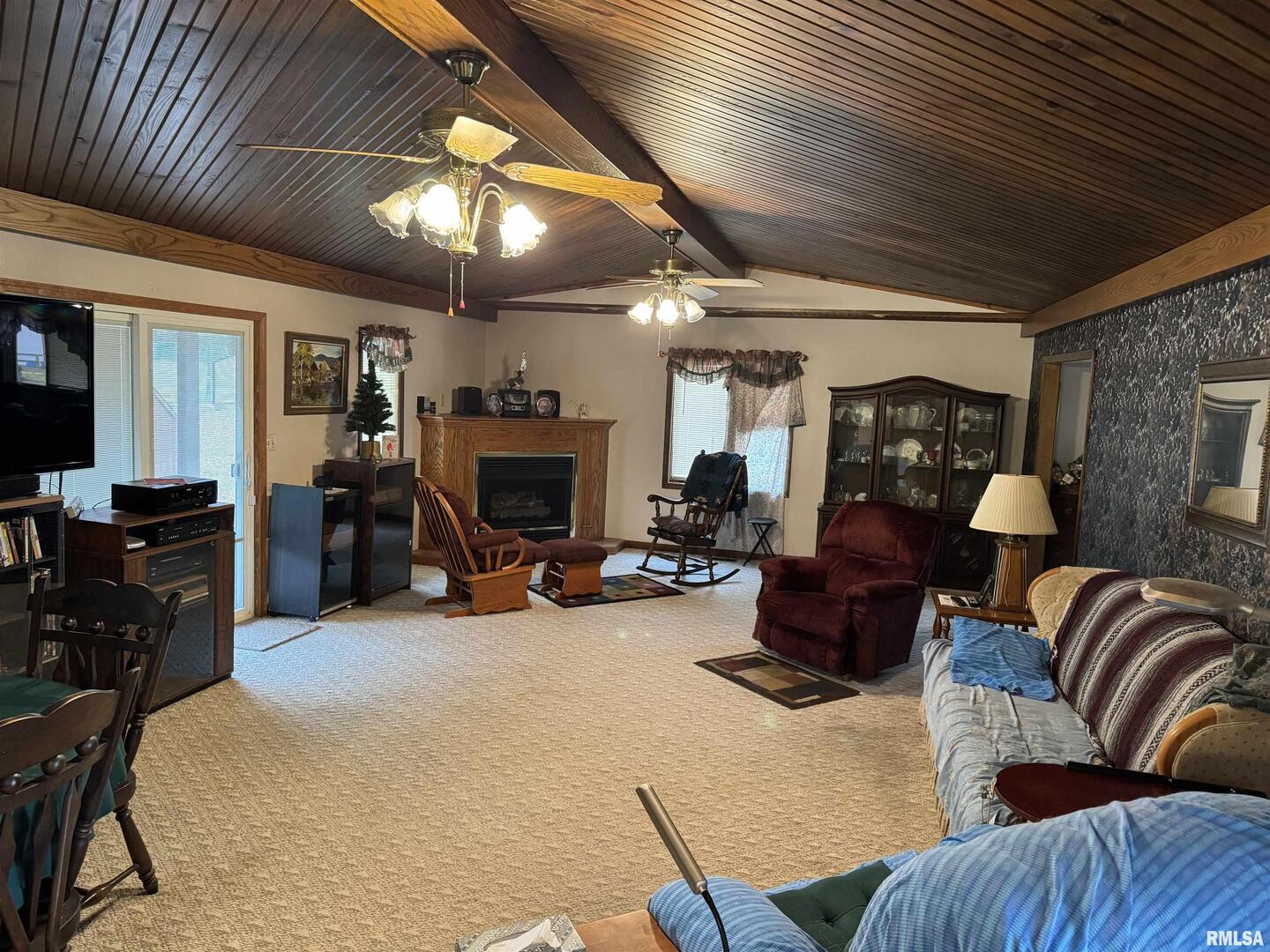 8424 Bolen Store Road Thompsonville, IL 62890 - Photo 4 of 30 a living room with furniture a fireplace and a chandelier