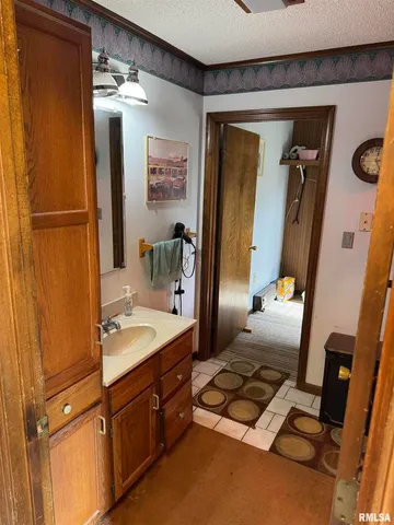 a bathroom with a sink a mirror and a shower