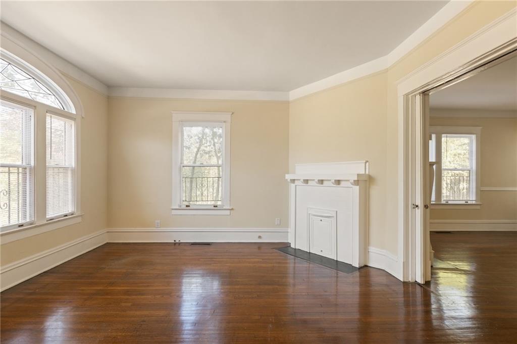 120 South Candler Street Decatur, GA 30030 - Photo 34 of 40 an empty room with wooden floor and windows