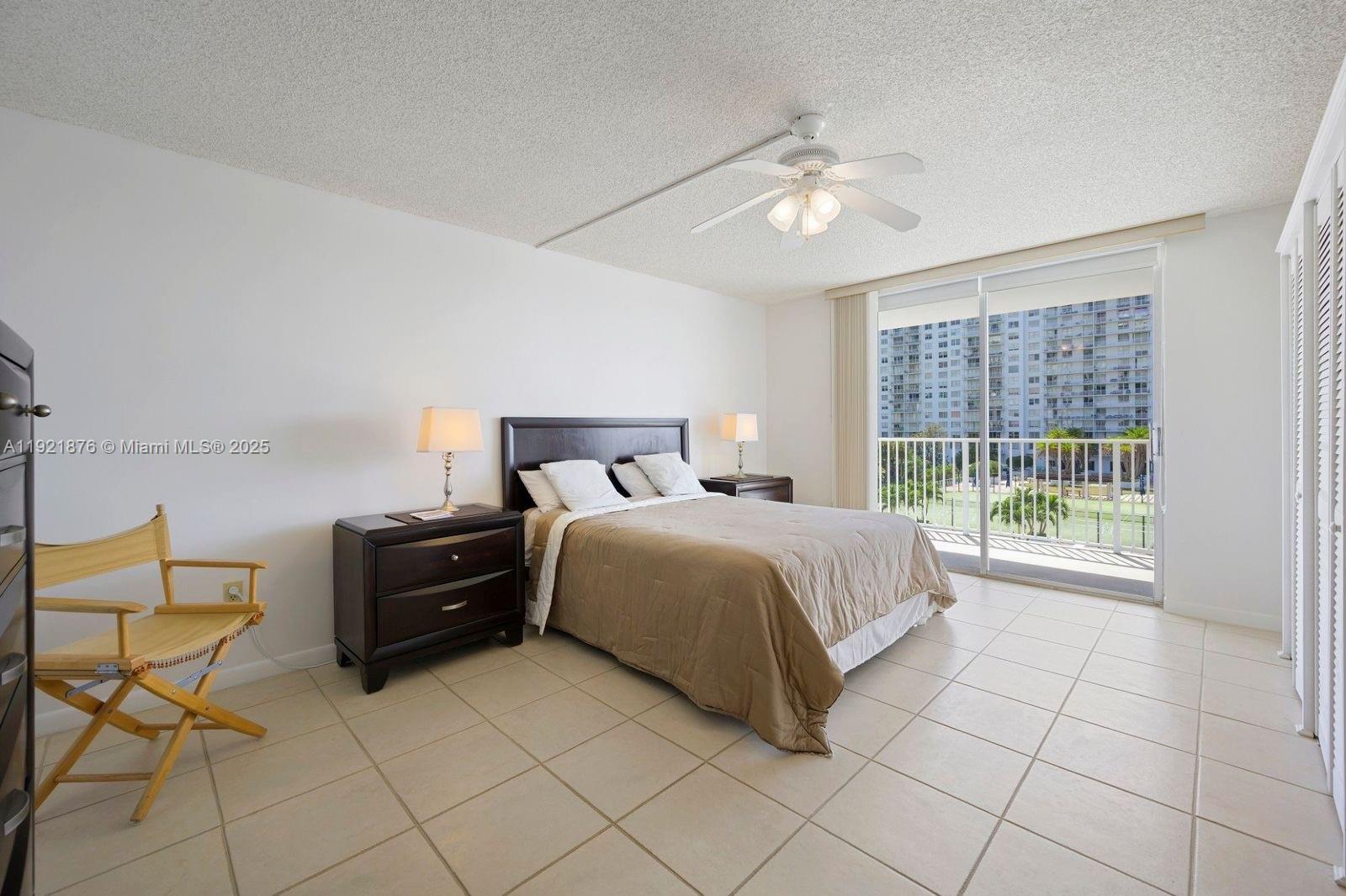2851 Northeast 183rd Street, Unit 502E Aventura, FL 33160 - Photo 14 of 25 a bedroom with a bed and window