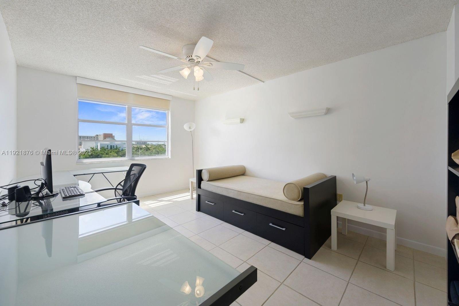 2851 Northeast 183rd Street, Unit 502E Aventura, FL 33160 - Photo 22 of 25 a living room with furniture and floor to ceiling window