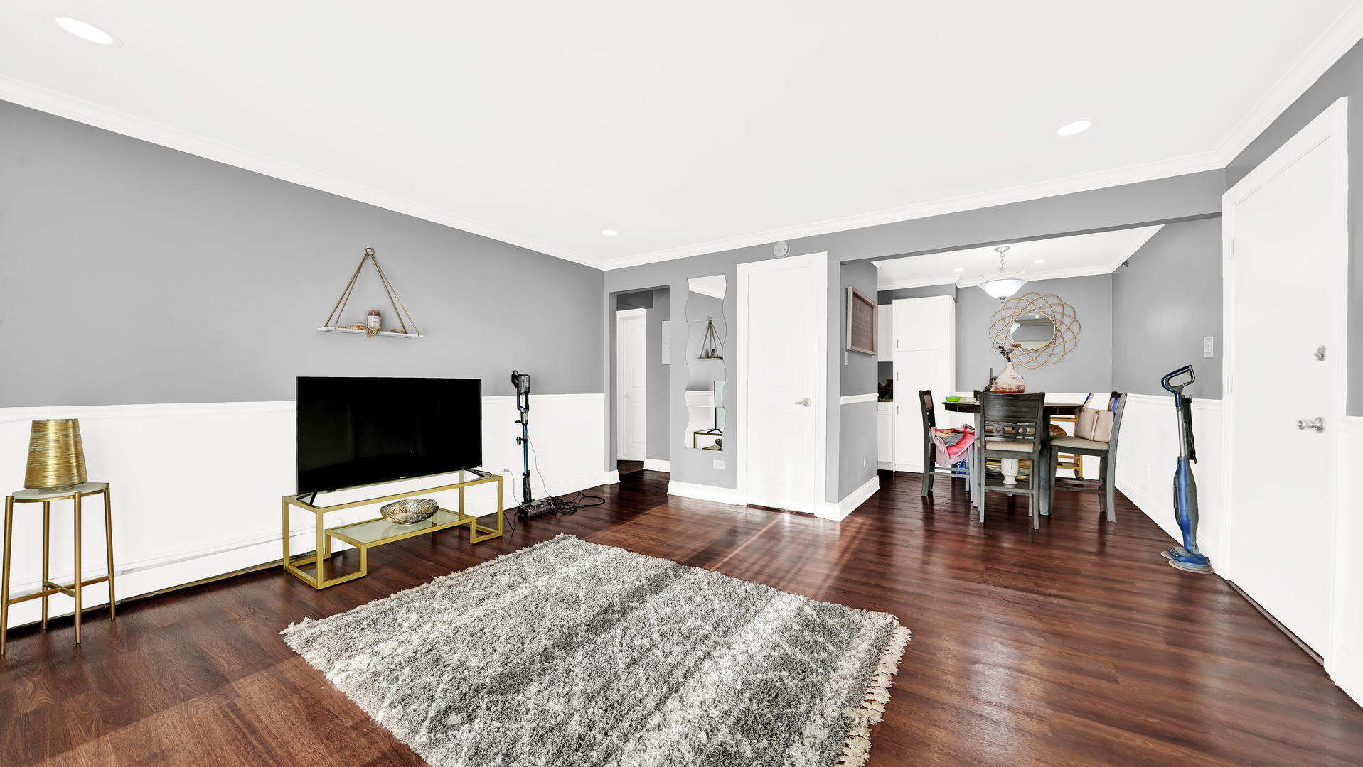 10324 Ridgeland Avenue, Unit 105 Chicago Ridge, IL 60415 - Photo 2 of 11 a living room with furniture and a flat screen tv