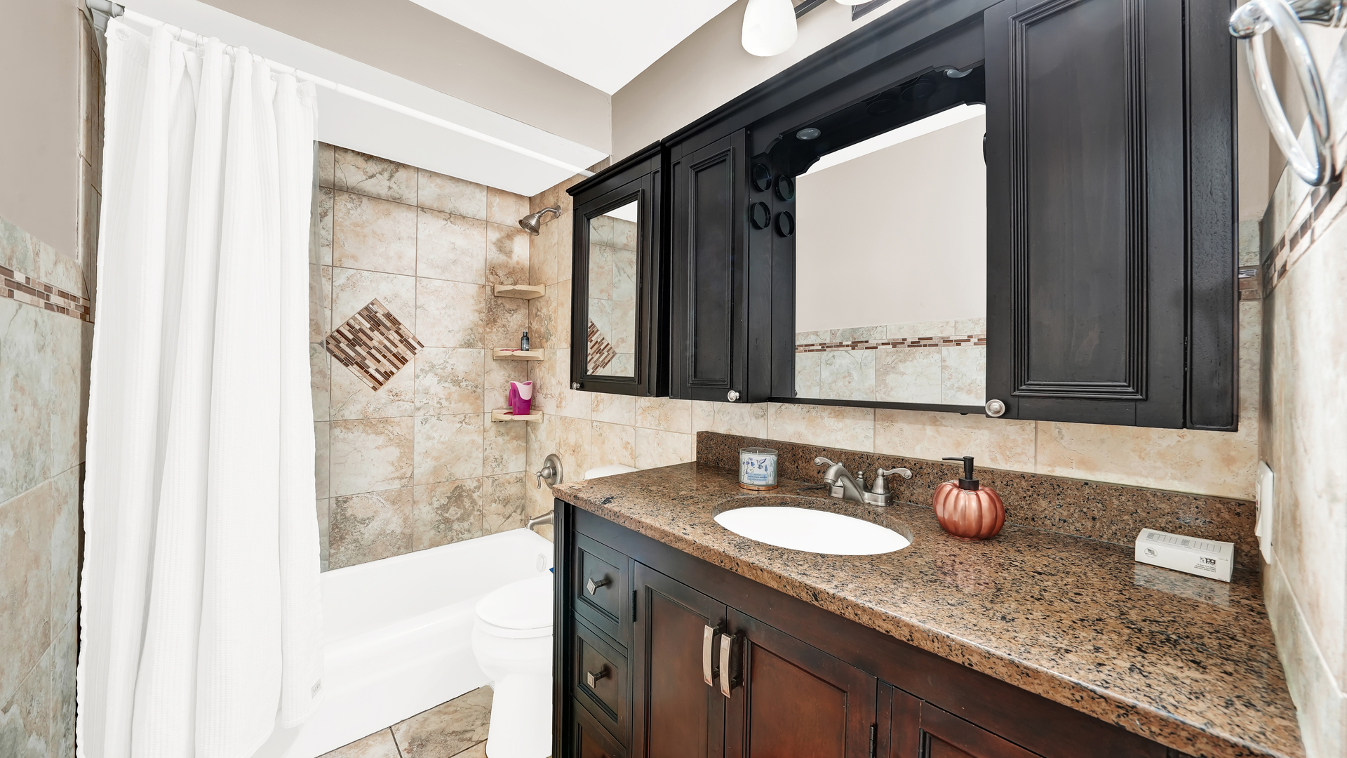 10324 Ridgeland Avenue, Unit 105 Chicago Ridge, IL 60415 - Photo 7 of 11 a bathroom with a granite countertop sink and a mirror