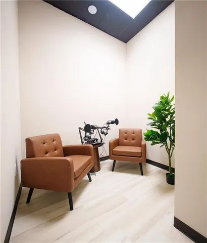 a bedroom with furniture and a potted plant