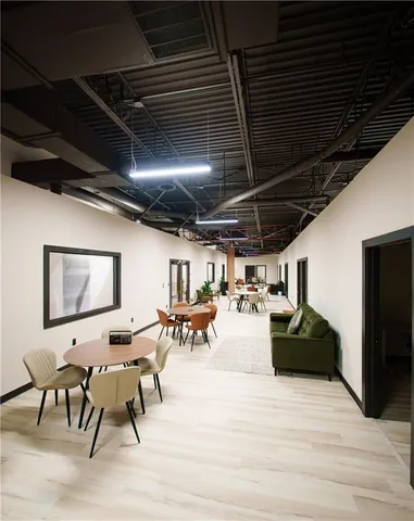 a view of a patio with table and chairs