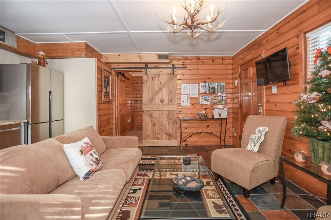 39016 1/2 Robin Road Big Bear Lake, CA 92315 - Photo 12 of 23 a living room with furniture and a rug