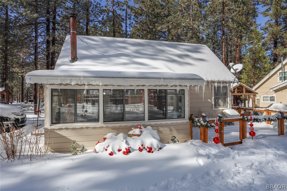 39016 1/2 Robin Road Big Bear Lake, CA 92315 - Photo 21 of 23 a front view of a house with a sitting area