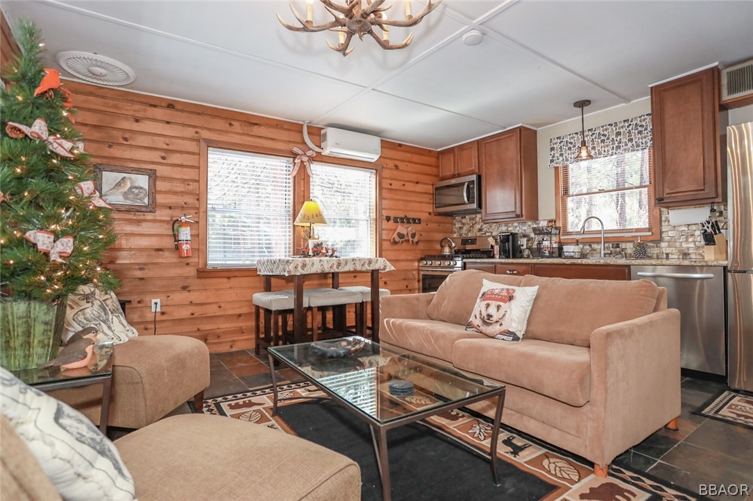 39016 1/2 Robin Road Big Bear Lake, CA 92315 - Photo 4 of 23 a living room with furniture and a large window