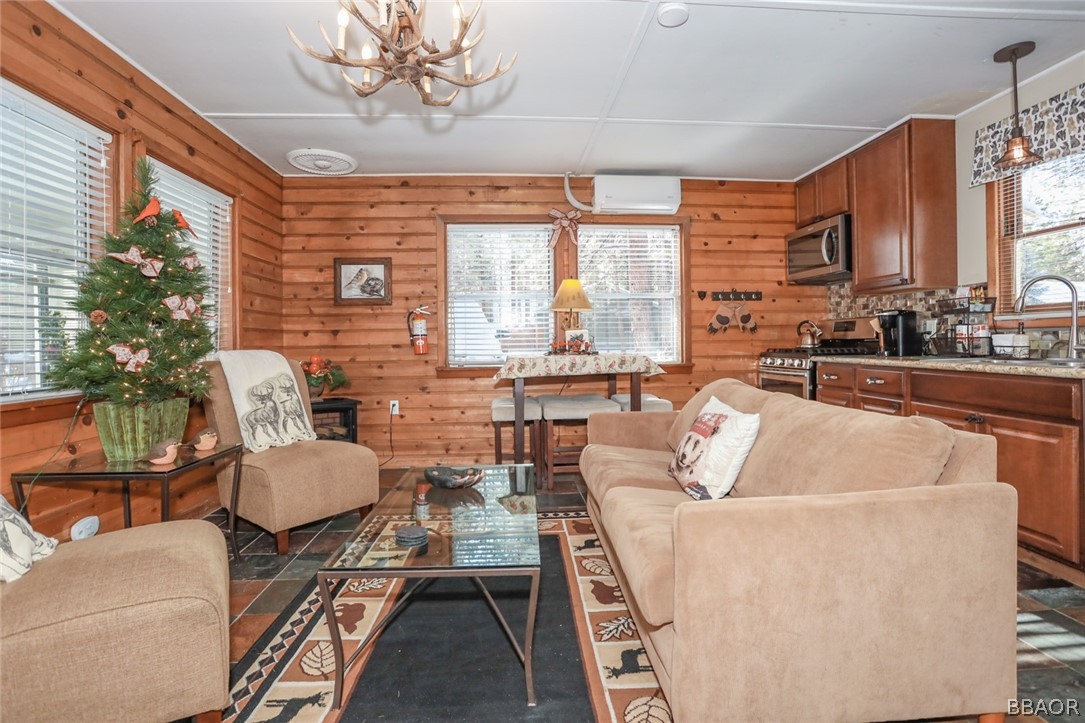 39016 1/2 Robin Road Big Bear Lake, CA 92315 - Photo 5 of 23 a living room with furniture and a large window