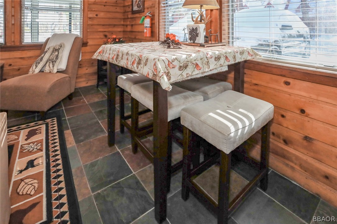 39016 1/2 Robin Road Big Bear Lake, CA 92315 - Photo 9 of 23 a view of a patio with table and chairs