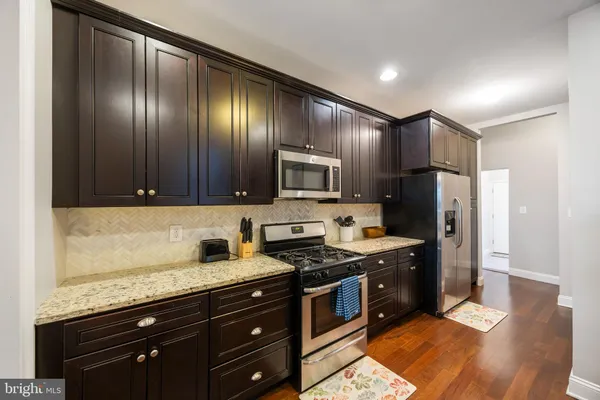 an empty room with wooden floor