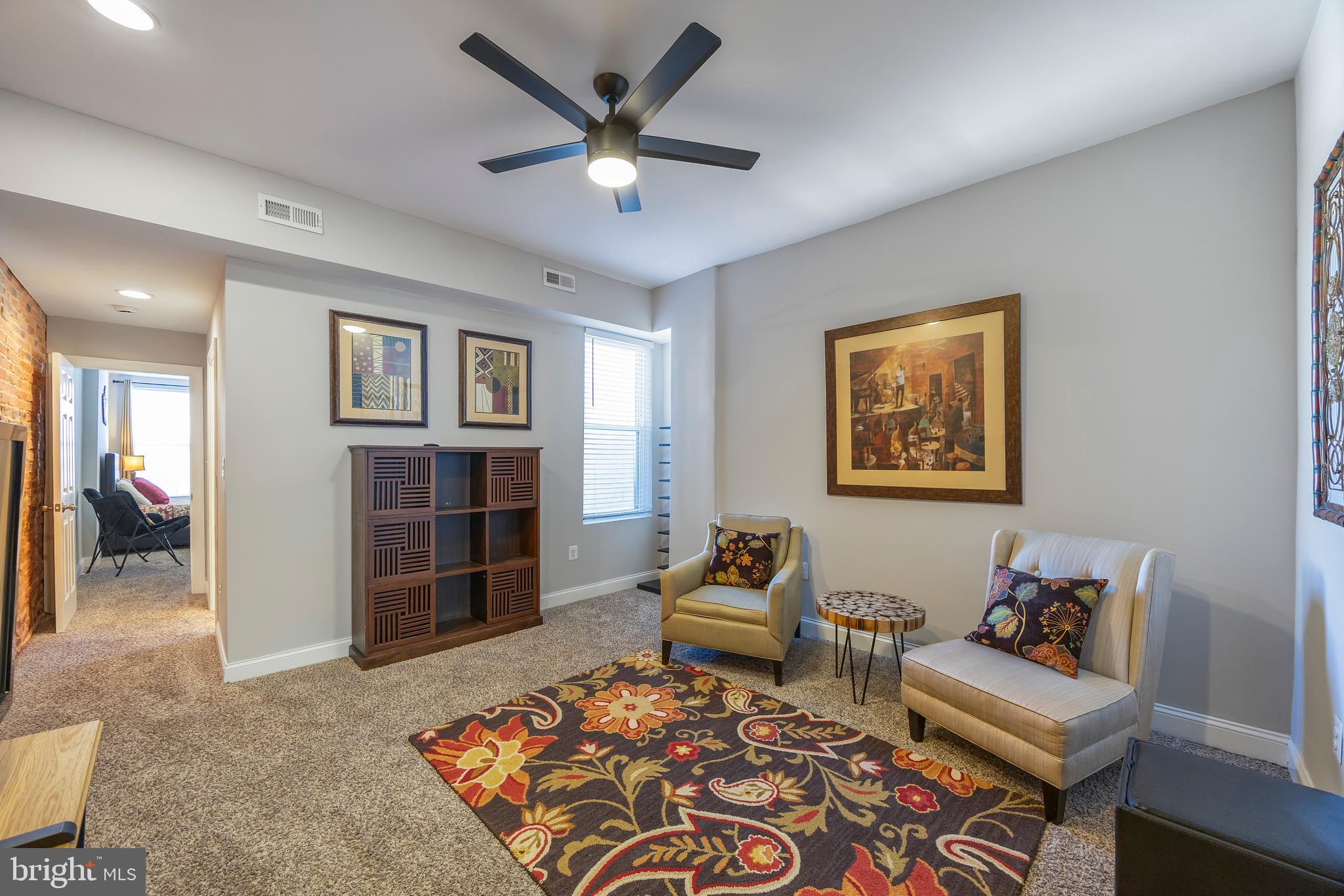 314 East 22nd Street Baltimore, MD 21218 - Photo 21 of 34 a living room with furniture and wooden floor