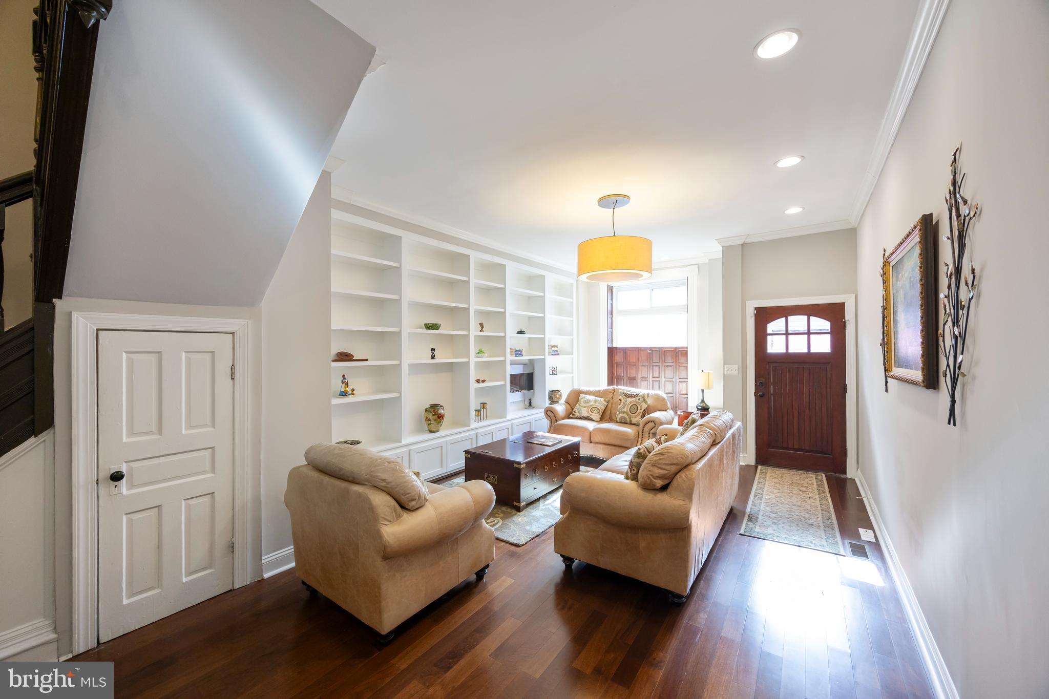 314 East 22nd Street Baltimore, MD 21218 - Photo 6 of 34 a living room with furniture and wooden floor