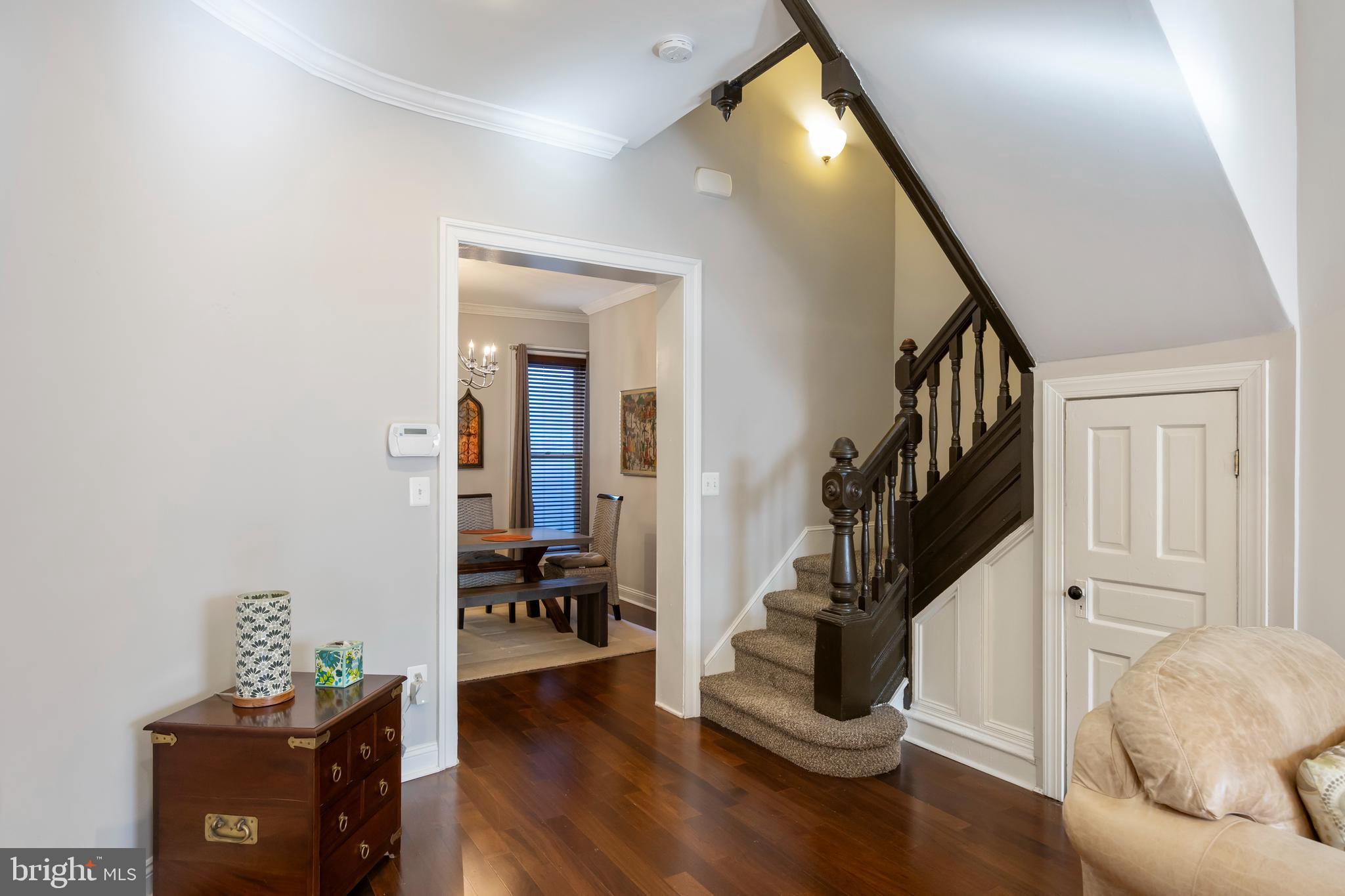 314 East 22nd Street Baltimore, MD 21218 - Photo 8 of 34 a livingroom with furniture and stairs